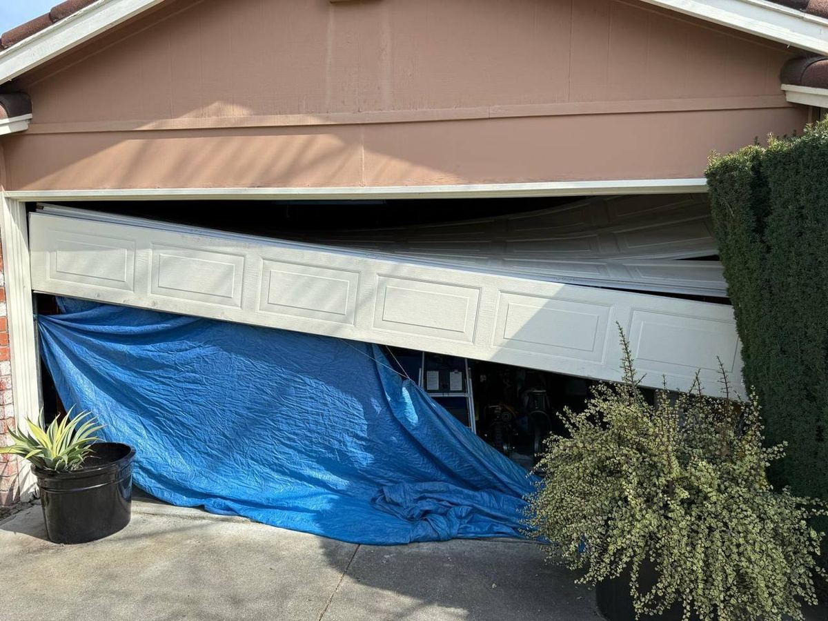 Garage door off its track before emergency repair